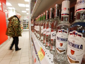 A customer scans shelves of vodka in a supermarket amid the coronavirus pandemic in Moscow, Russia on April 8, 2020.