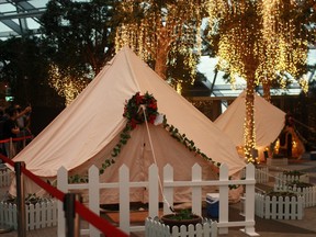 Glamping tents decked out in Christmas decorations and a backdrop of fairy lights are seen at Changi Airport, Singapore, December 21, 2020.