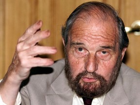 Soviet secret agent George Blake gestures as he speaks at a presentation of a book of letters written by other spies from a British prison, in Moscow June 28, 2001.