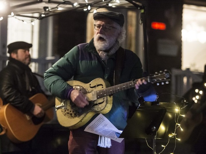  Ken Whiteley leads a small group of neighbours by singing in support of frontline workers on Toronto’s Roxton Road during the Covid 19 Pandemic, Tuesday November 24, 2020.
