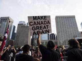 Far-right and ultranationalist groups, including the Northern Guard, Proud Boys, as well as individuals wearing Soldiers of Odin patches, were among those gathered at Nathan Philips Square in Toronto on Saturday, Oct. 21, 2017.