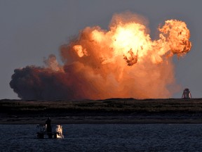 SpaceX's first super heavy-lift Starship SN8 rocket explodes during a return-landing attempt after it launched from their facility on a test flight in Boca Chica, Texas on December 9, 2020.