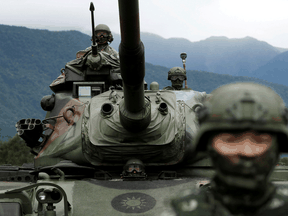 A Taiwanese soldier stands in front of a M60A3 tank during a military drill in Hualien, Taiwan, in 2018.