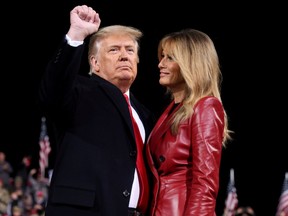 U.S. President Donald Trump gestures next to first lady Melania Trump after speaking at a campaign event for Republican U.S. senators David Perdue and Kelly Loeffler in Valdosta, Ga., on Dec. 5.