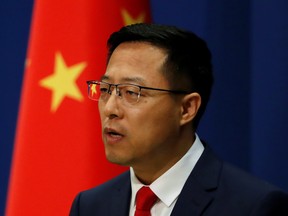 Chinese Foreign Ministry spokesman Zhao Lijian attends a news conference in Beijing on Sept. 10.