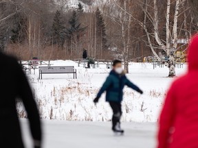 Skaters take to the Rundle Park IceWay Skating Trail in Edmonton, on Tuesday, Dec. 22, 2020.