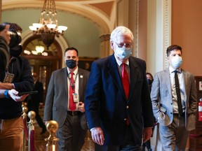 Senate Majority Leader Mitch McConnell (R-KY) walks back to his office after opening up the Senate on Capitol Hill on December 14, 2020 in Washington, DC.