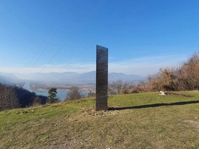 A metal monolith stands on the hills of Batca Doamnei, near Piatra Neamt, Romania, November 27, 2020.