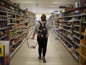 A shopper browses an aisle for groceries at a Tesco Superstore in south London on September 30, 2019. - Tesco, Britain's biggest food retailer, will report its first-half results on October 2.