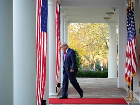 In this file photo US President Donald Trump arrives to deliver an update on "Operation Warp Speed" in the Rose Garden of the White House in Washington, DC on November 13, 2020.