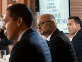 Justice Minister David Lametti, centre, with President of the Inuit Tapiriit Kanatami Natan Obed, left, and Assembly of First Nations Chief Perry Bellegarde at a news conference about the United Nations Declaration on the Rights of Indigenous Peoples (UNDRIP), in Ottawa on Dec. 3, 2020.