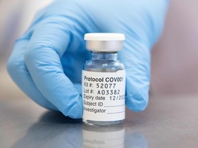 In this file photo taken on November 23, 2020 An undated handout picture released by the University of Oxford, shows a vial of the University's COVID-19 candidate vaccine, known as AZD1222, co-invented by the University of Oxford and Vaccitech in partnership with pharmaceutical giant AstraZeneca.