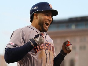 George Springer #4 of the Houston Astros celebrates his fifth inning inside the park home home run while playing the Detroit Tigers at Comerica Park on May 14, 2019 in Detroit, Michigan.