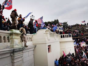 Thousands of Donald Trump supporters storm the United States Capitol building following a "Stop the Steal" rally in Washington, D.C., on Jan. 6.