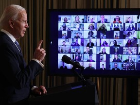 U.S. President Joe Biden conducts a virtual swearing in ceremony Wednesday for members of his new administration via Zoom just hours after his inauguration.