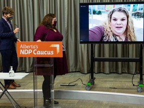 NDP MLAs Sarah Hoffman and Janis Irwin listen as Lia Lousier speaks out against vacationing UCP MLAs, who’s family had to cancel a Make A Wish trip to Hawaii for her son Braeden, during a press conference in Edmonton, on Monday, Jan. 4, 2021.