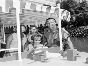 In this handout photo provided by Disney Parks, Baseball legend Stan Musial and his family are seen on the Jungle Cruise attraction at Disneyland Park in July, 1965 in Anaheim, California.