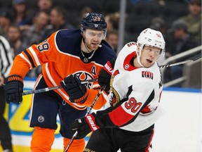 Edmonton Oilers' Leon Draisaitl (29) hits Ottawa Senators' Vladislav Namestnikov (90) drawing a penalty during the third period of a NHL hockey game at Rogers Place in Edmonton, on Wednesday, Dec. 4, 2019.