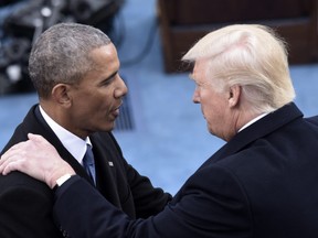 Barrack Obama greets Donald Trump as they arrive for Trump's swearing-in ceremonyl in Washington on January 20, 2017.