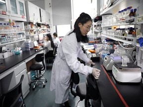 Dr. Shuhui Sun performs histological staining of mouse liver for pathological analysis in the Aging and Regeneration lab at the Institute for Stem Cell and Regeneration of the Chinese Academy of Sciences (CAS) in Beijing, China, January 12, 2021.