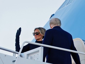 U.S. first lady Melania Trump waves as she and President Donald Trump board Air Force One at Joint Base Andrews, Maryland, U.S., January 20, 2021.