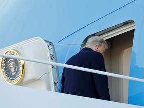 U.S. President Donald Trump boards Air Force One at Joint Base Andrews, Md., on Jan. 20., 2021, to depart Washington at the end of his presidency.