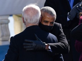 Former U.S. president Barak Obama congratulates his former vice-president, Joe Biden, after Biden was sworn in as president on Jan. 20, 2021, at the U.S. Capitol in Washington, D.C.