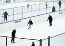 People get exercise at an outdoor skating rink amid the a provincewide COVID-19 lockdown in Toronto on January 14, 2021.