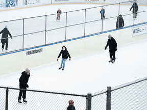 People get exercise at an outdoor skating rink amid the a provincewide COVID-19 lockdown in Toronto on January 14, 2021.