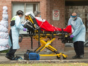 First responders transport a resident from a long-term care facility in Montreal on Nov. 20, 2020.