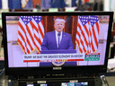 An image of U.S. President Donald Trump speaking in a video released on YouTube is seen on a monitor in the Brady Briefing Room of the White House on January 19, 2021.