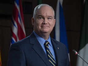 Conservative Party Leader Erin O'Toole listens to a question from a reporter during a news conference in Ottawa on Dec. 7, 2020.