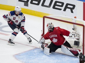Canada's goalie Devon Levi is scored on by the United States' Trevor Zegras (9) in the IIHF world junior championship gold-medal game on Tuesday, Jan. 5, 2021 in Edmonton.
