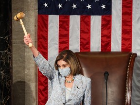 Speaker of the House Nancy Pelosi swears in new members of Congress in the House Chamber at the U.S. Capitol on Jan. 3, 2021, in Washington, D.C. Pelosi is proposing to introduce gender-neutral  language for House rules.