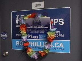 The constituency office door of Ontario MPP and now former provincial finance minister Rod Phillips is festooned with a Hawaiian lei on Dec. 31, 2020.