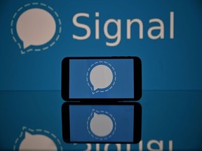 This photograph taken on 11 January, 2021 in Toulouse, southwestern France, shows the logo of Signal mobile messaging service. - Secure messaging app Signal is on the top downloads on Apple Store and Google Play platforms in several countries after the popular messaging app WhatsApp asked its some two billion users on January 7, 2021 to accept new terms that will allow it to share more information with its parents company Facebook.