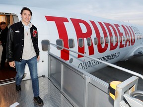 Justin Trudeau exits his election campaign plane at the Vancouver airport in a file photo from Oct. 12, 2019.