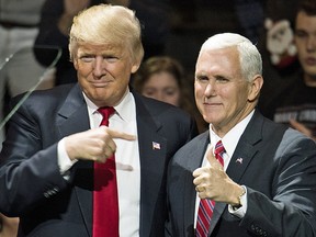 Donald Trump and Mike Pence celebrate victory together in the 2016 general election in Cincinnati, Ohio.