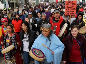 Participants march to the Alberta Legislature in Edmonton following the closing ceremonies of the seventh and final Truth and Reconciliation Commission event, on March 29, 2014.