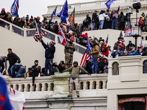 Pro-Trump supporters storm the U.S. Capitol following a rally with President Donald Trump on Jan. 6, 2021.