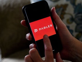 This illustration file photo taken on July 2, 2020 shows social media application logo Parler displayed on a smartphone in Arlington, Virginia.