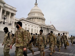 Members of the National Guard arrive to the U.S. Capitol days after supporters of U.S. President Donald Trump stormed the Capitol in Washington, U.S. January 11, 2021.