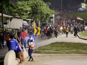 The migrant caravan start on foot the journey towards the Guatemalan border on January 15, 2021 in San Pedro Sula, Honduras