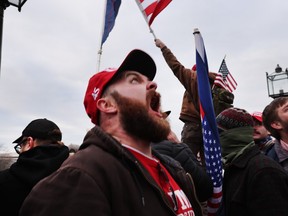 Thousands of Donald Trump supporters storm the United States Capitol building following a "Stop the Steal" rally on January 06, 2021 in Washington, DC.