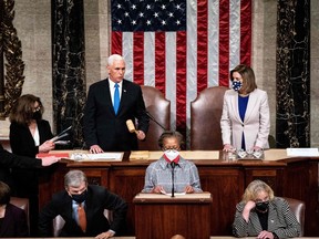 Vice President Mike Pence and House Speaker Nancy Pelosi preside over a Joint session of Congress to certify the 2020 Electoral College results after supporters of President Donald Trump stormed the Capitol earlier in the day on Capitol Hill in Washington, DC on January 6, 2020.
