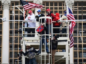 A mob riots at the U.S. Capitol in support of President Donald Trump on Jan. 6.