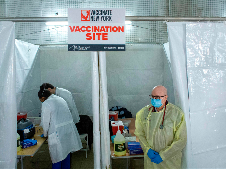  Helath workers wait for patients to administer Pfizer Covid-19 vaccines at the opening of a new vaccination site at Corsi Houses in Harlem New York on January 15, 2021.