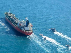 A picture obtained by AFP from the Iranian news agency Tasnim on Jan. 4, 2021, shows the South Korean-flagged tanker being escorted by Iran's Revolutionary Guards navy after being seized in the Gulf.