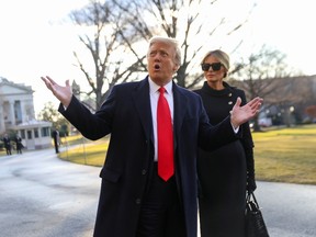 U.S. President Donald Trump gestures as he and first lady Melania Trump depart the White House to board Marine One ahead of the inauguration of president-elect Joe Biden, in Washington, U.S., January 20, 2021.