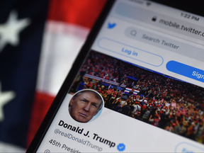 In this photo illustration, the Twitter account of US President Donald Trump is displayed on a mobile phone on August 10, 2020, in Arlington, Virginia.
